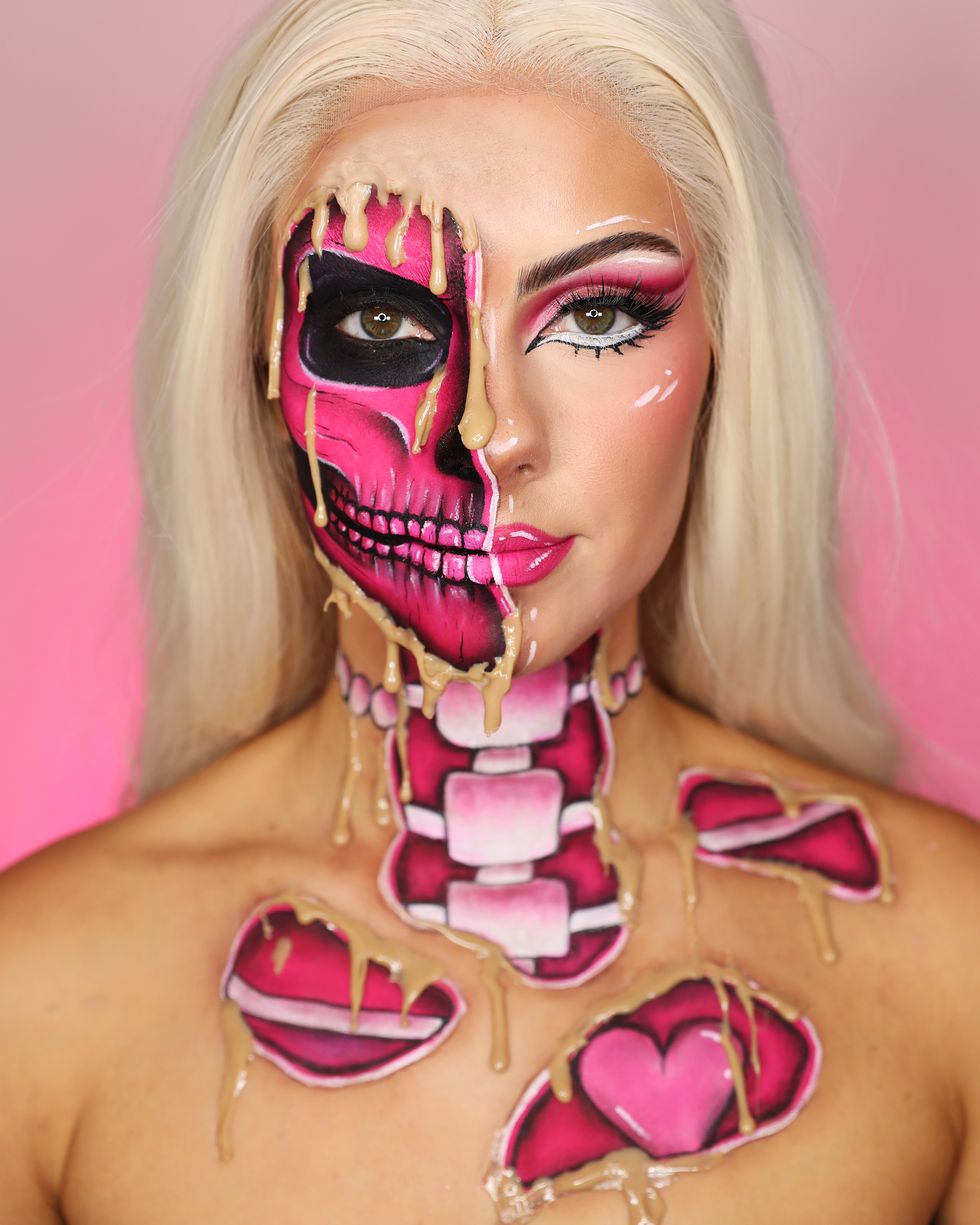 a person with pink makeup and a pink background