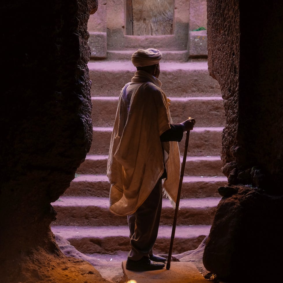 Water, Standing, Human, Shadow, Temple, Tints and shades, Adaptation, Outerwear, Stock photography, Photography, 