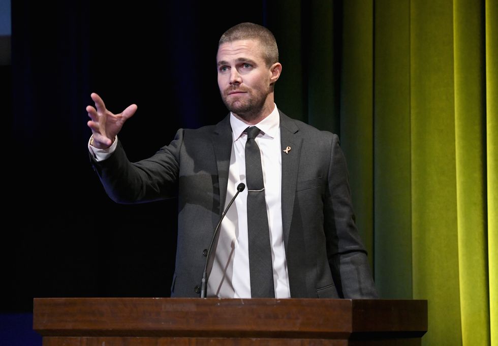 stephen amell accepts the hero award onstage at the barbara berlanti heroes gala benefitting fcance