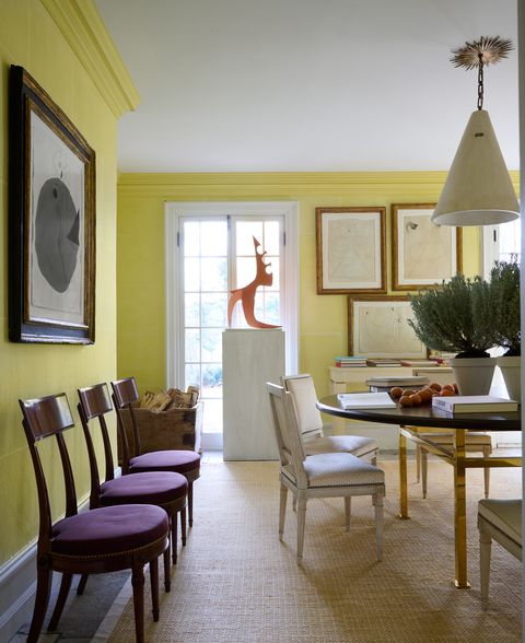 the citron yellow dining at stephen sills' country home in bedford, new york