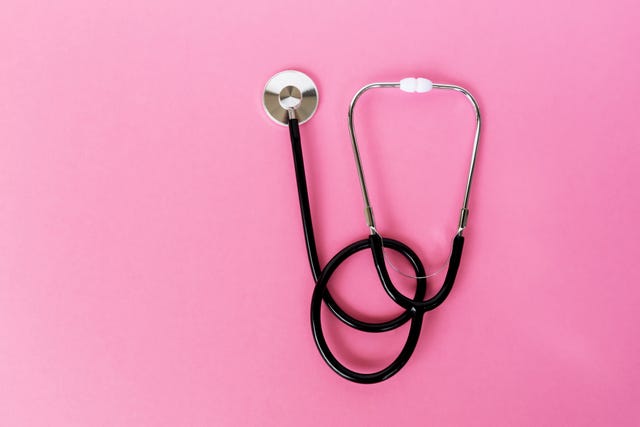 stethoscope on pink background