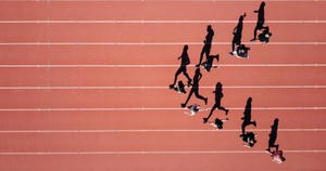 a group of people running on a track