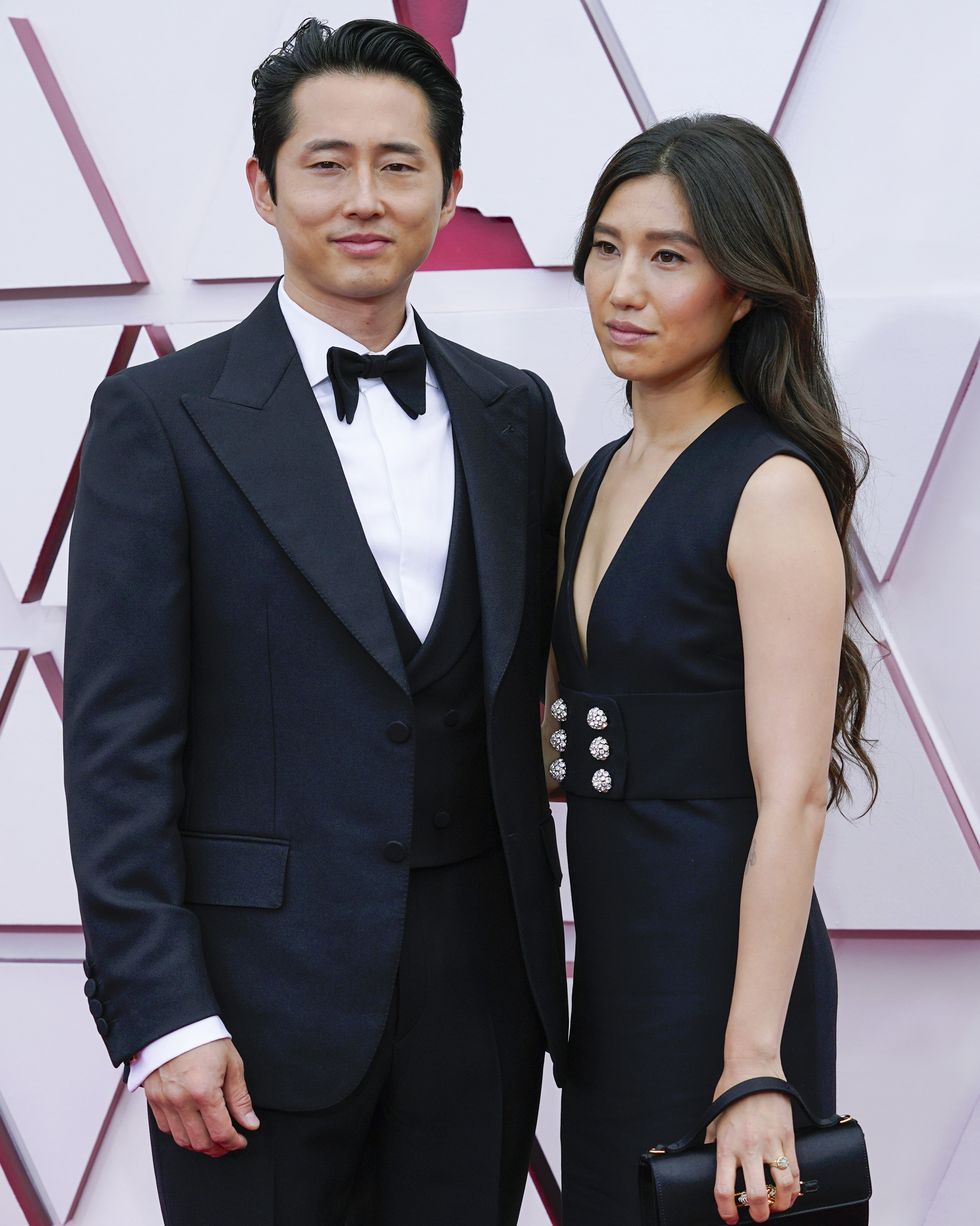 steven yeun and wife joana pak pose for a photo on the oscar red carpet