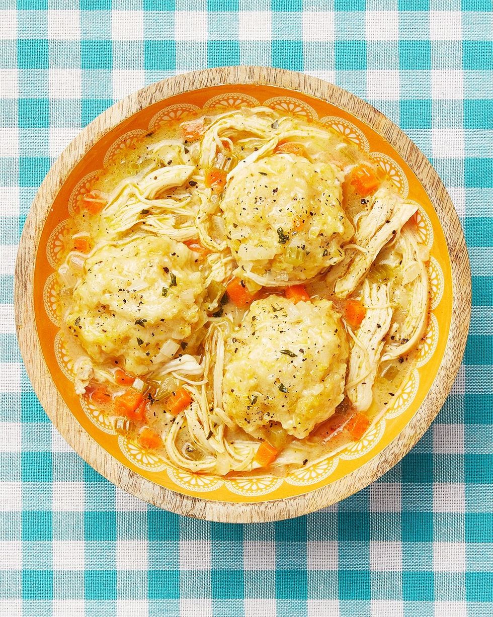 chicken and dumplings in bowl on teal checkered surface