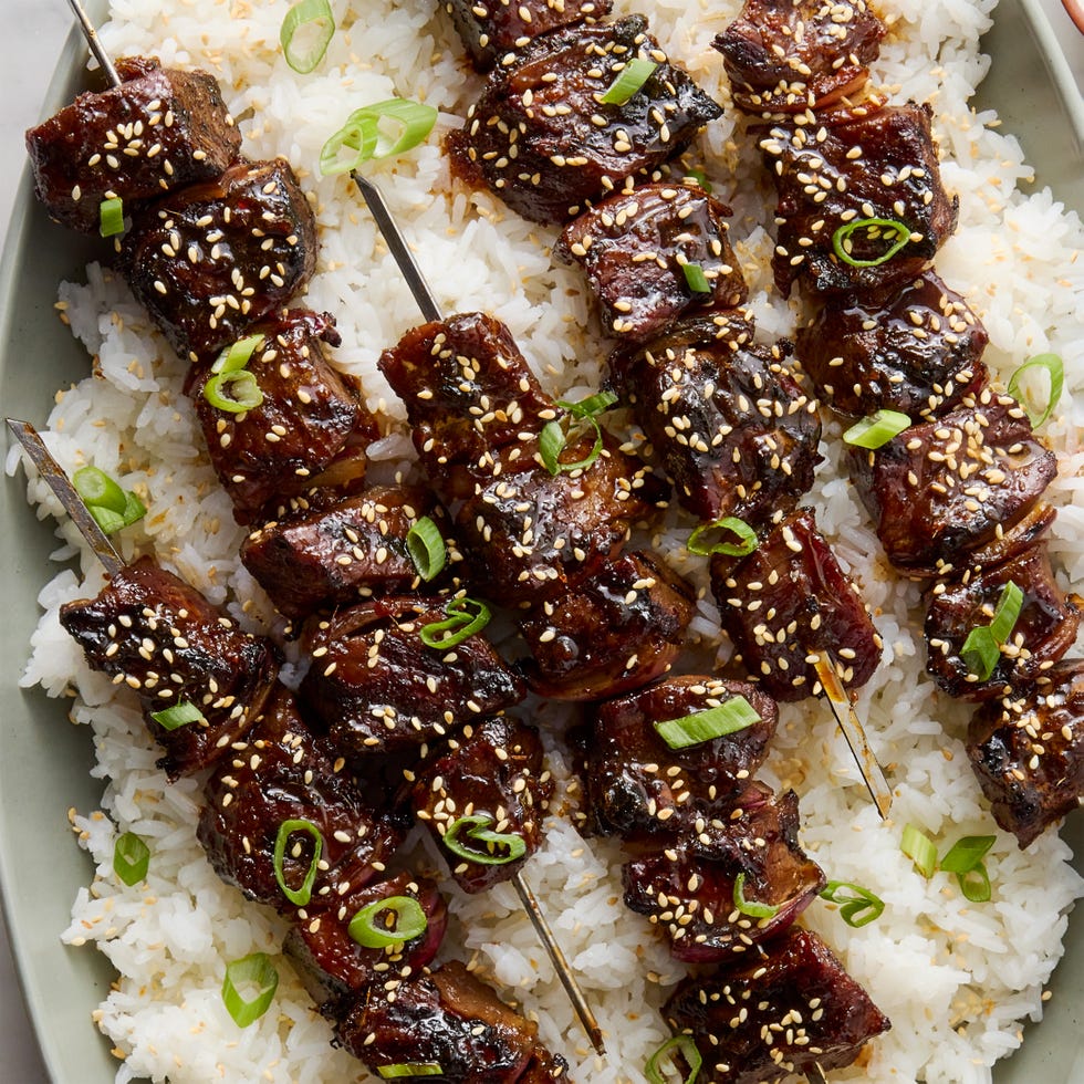 marinated pieces of sirloin steak in soy and chili garlic sauce, skewered with red onion, and brushed with a sweet and savory honey garlic glaze