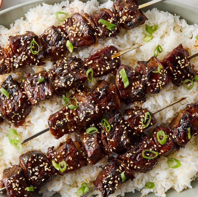 Sticky Soy Steak Skewers marinated pieces of sirloin steak in soy and chili garlic sauce, skewered with red onion, and brushed with a sweet and savory honey garlic glaze