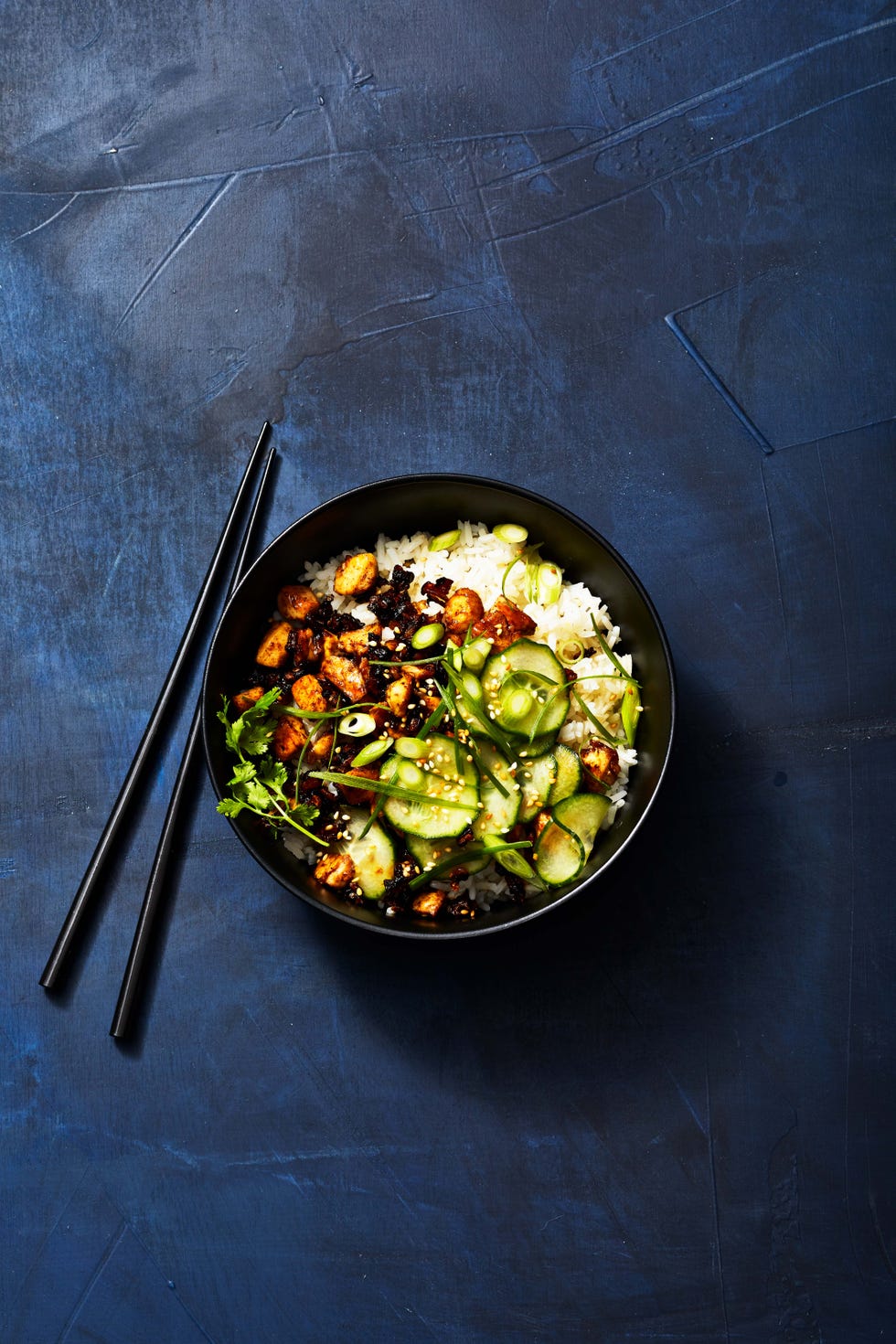 sticky tofu bowl with cucumber and white rice