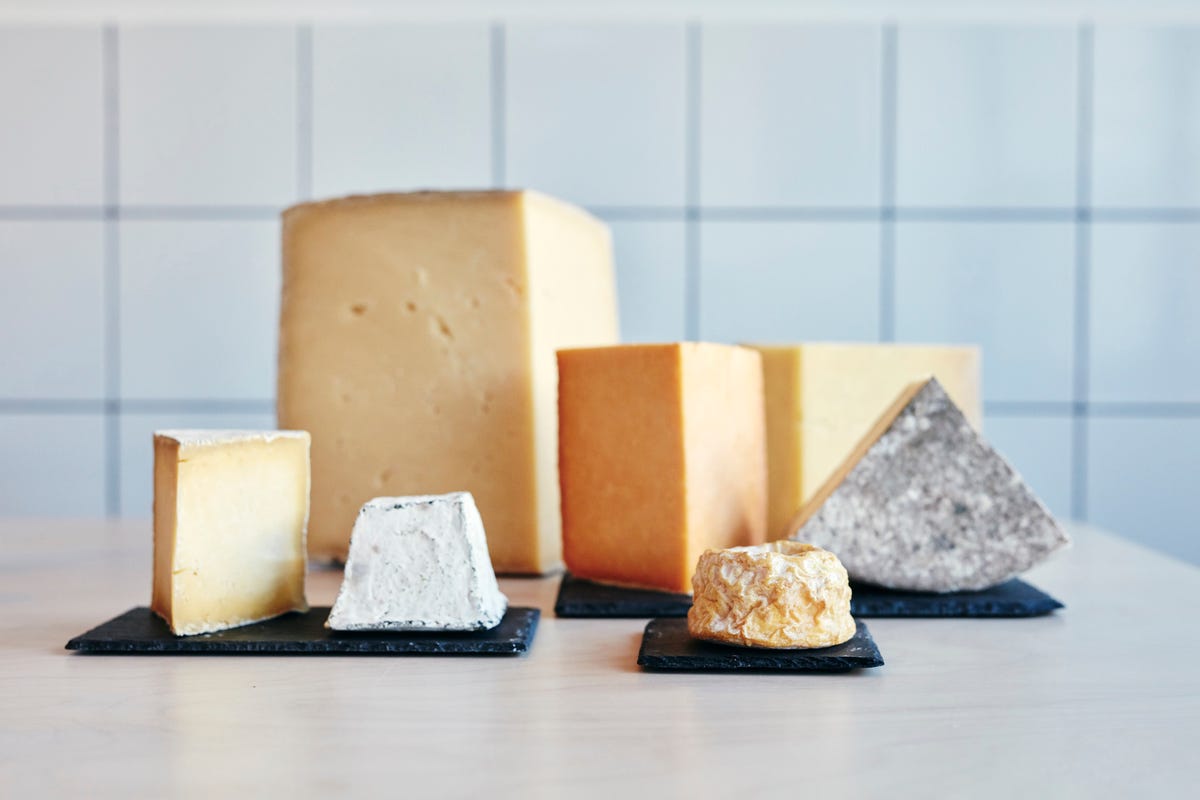 https://hips.hearstapps.com/hmg-prod/images/still-life-of-a-range-of-cheeses-on-table-top-royalty-free-image-1690901243.jpg?crop=0.668xw:1.00xh;0.167xw,0&resize=1200:*