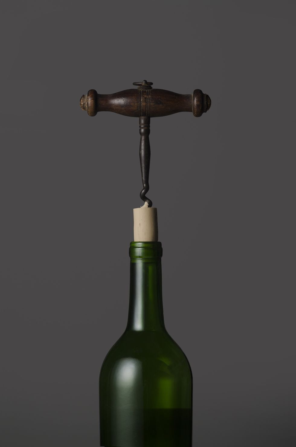 Wine Bottle With Antique Wood Corkscrew