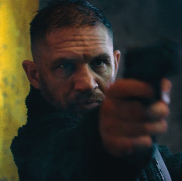 a person holding a firearm in a tense situation a person holding a firearm in a tense situation