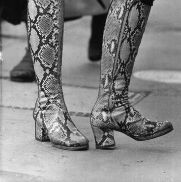 knee length fashion boots in a patterned design legs only visible photo by evening standardgetty images