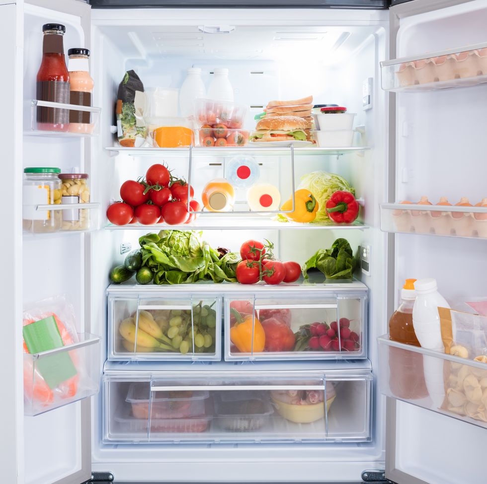 open refrigerator filled with fresh fruits and vegetable