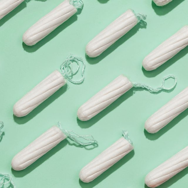 white tampons on a green background