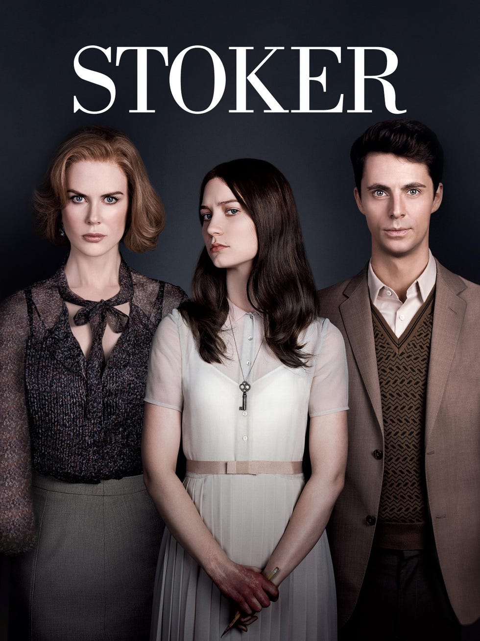 promotional image for the film stoker featuring three characters standing together