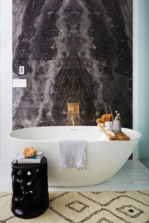 teal bathroom with stone marble backsplash