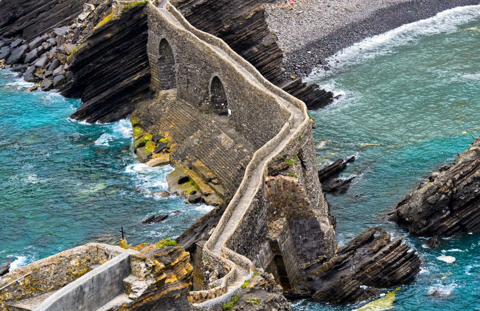 stone bridge to the islet gaztelugatxe near bakio, costa vasca, bay of biscay, basque country, spain