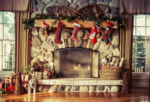 stone fireplace decorated for christmas