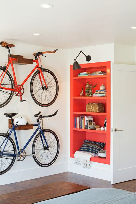 Bicycle wheel, Shelf, Bicycle, Red, Orange, Bicycle part, Shelving, Vehicle, Wall, Yellow, 