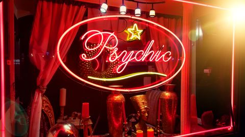store window of a psychic parlor in the east village, manhattan, new york city