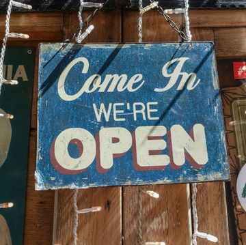 old fashioned, vintage come in we are open, scratched sign board hanging on a pub storefront, shop window, rome, italy, europe, european union, eu close up photo by glen sterlingucguniversal images group via getty images