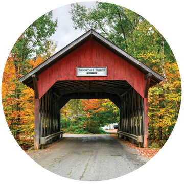 a red covered bridge in Stowe, Vermont a red covered bridge in stowe, vermont