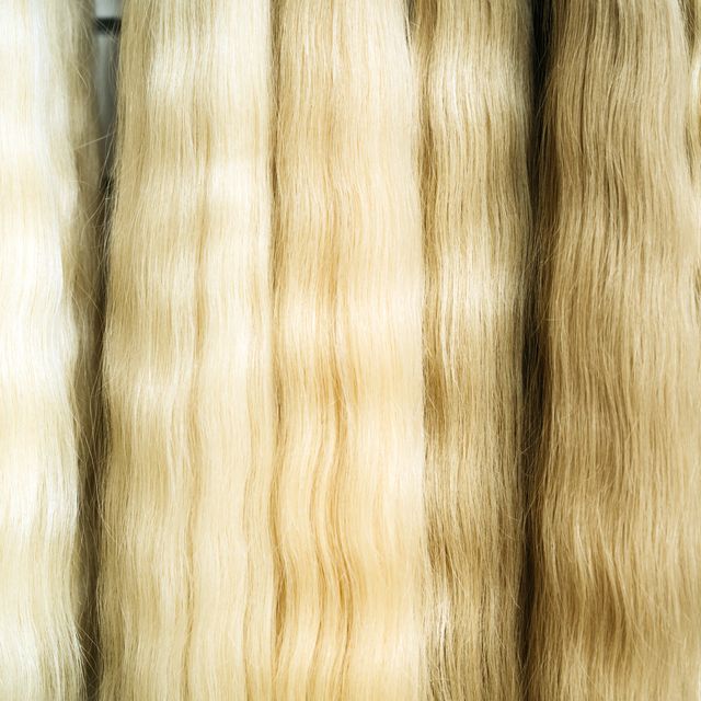 strands of natural hair in different colors and shades for hair extensions