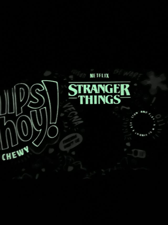title screen for stranger things on netflix with playful doodles and graphics