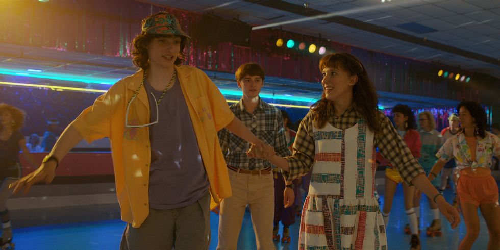 stranger things l to r finn wolfhard as mike wheeler, noah schnapp as will byers and millie bobby brown as eleven in stranger things cr courtesy of netflix © 2022