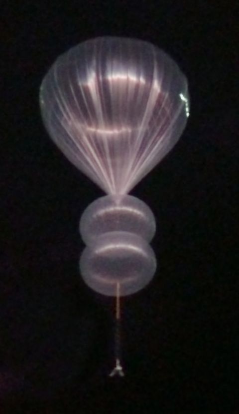 a world view stratollite balloon seen through a telescope at the mt lemmon sky center in arizona