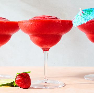 strawberry daiquiri in a glass with a beach umbrella