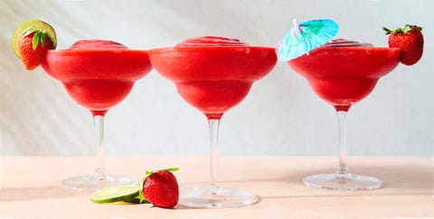strawberry daiquiri in a glass with a beach umbrella