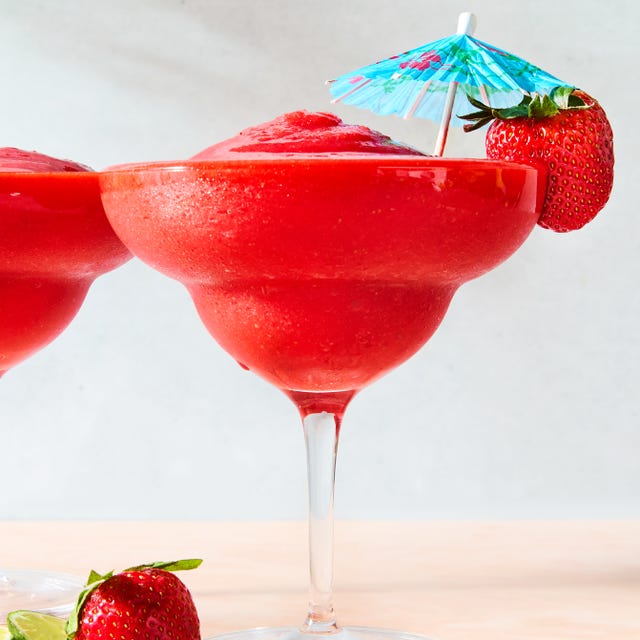 strawberry daiquiri in a glass with a beach umbrella