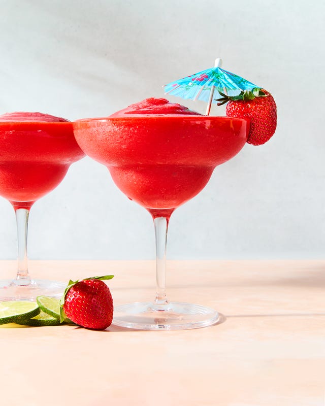 strawberry daiquiri in a glass with a beach umbrella