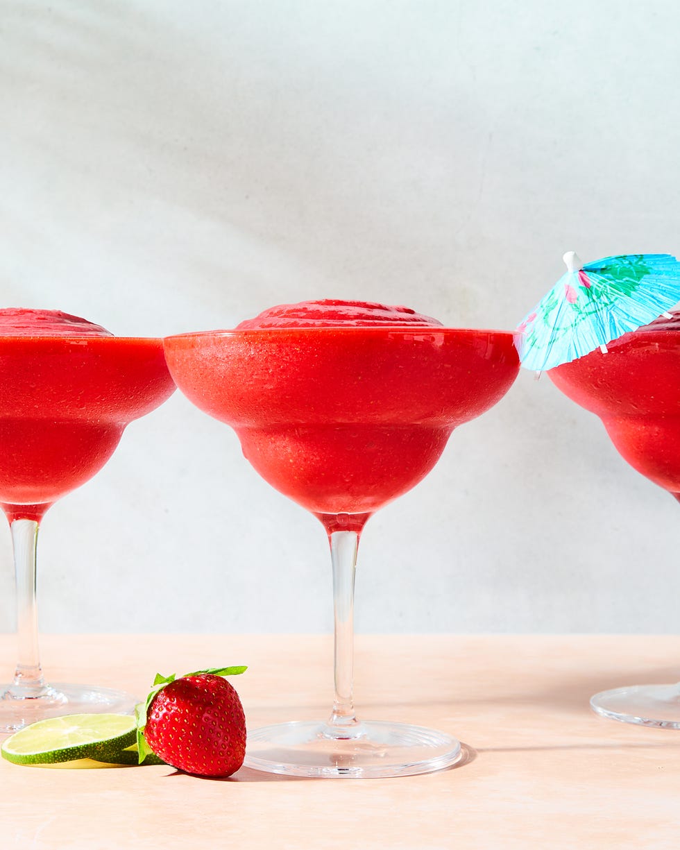 strawberry daiquiri in a glass with a beach umbrella