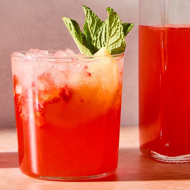 Strawberry Lemonade Shrub strawberry lemonade shrub with ice in a glass with mint