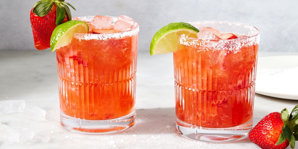 strawberry mezcal margarita with lime and strawberries