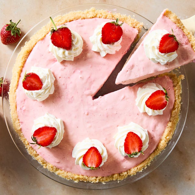 creamy strawberry pie topped with whipped cream and strawberries