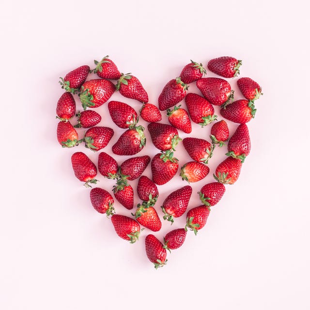 Strawberry on pink background. Flat lay, top view, square