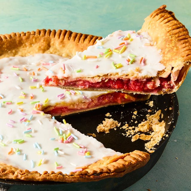 Strawberry Pop Tart Skillet Pie flaky pastry in a pie dish filled with strawberry filling and topped with icing and sprinkles