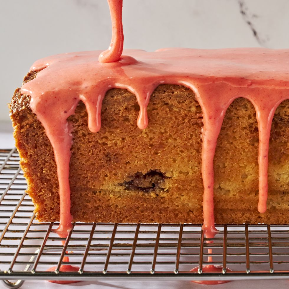 pound cake with a strawberry swirl and topped with a bright pink strawberry glaze