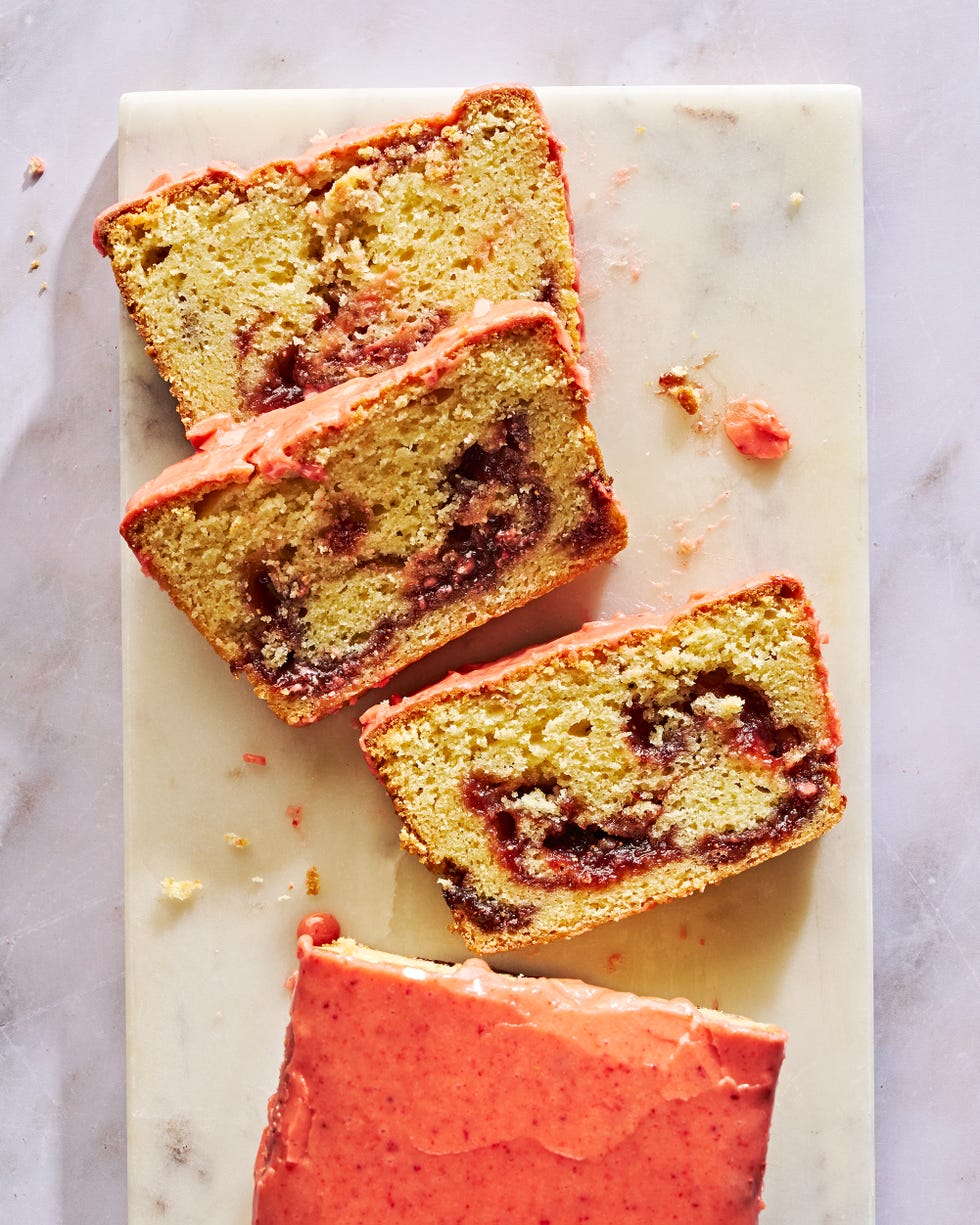 pound cake with a strawberry swirl and topped with a bright pink strawberry glaze