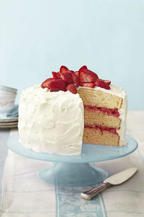 strawberry rhubarb layer cake with fresh strawberries on top