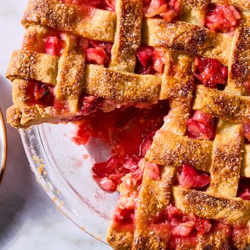 strawberry rhubarb filling in a pie with a lattice crust