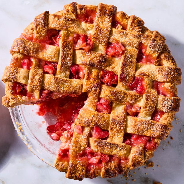 strawberry rhubarb filling in a pie with a lattice crust