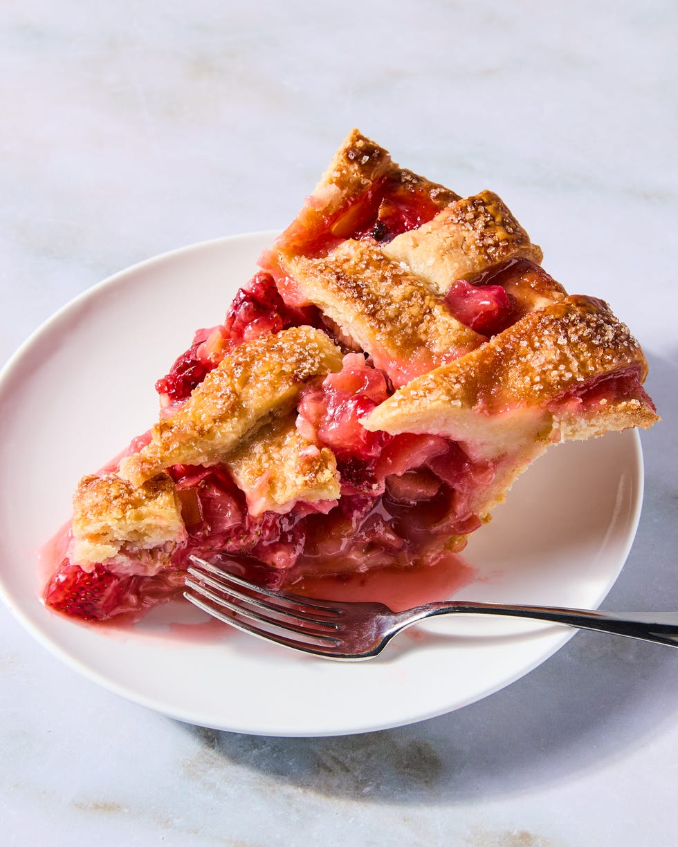 strawberry rhubarb filling in a pie with a lattice crust
