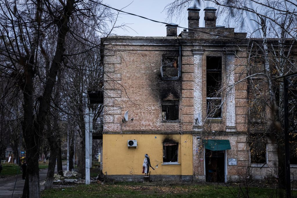 See Photos Of New Banksy Murals In Ukraine   Street Art Of A Person In A Dressing Gown Holding A Fire News Photo 1668528512 