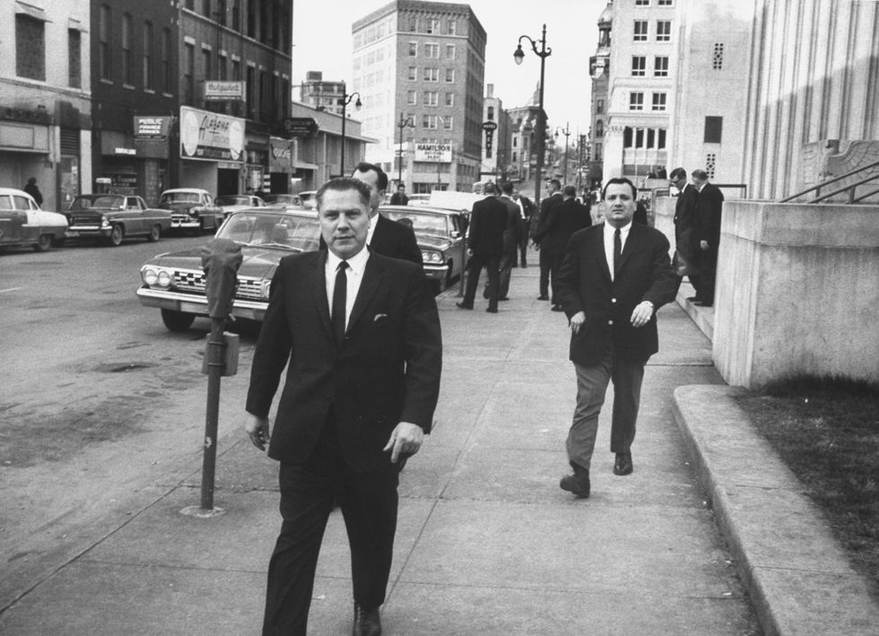 Jimmy Hoffa on the street outside a federal courthouse, where he is on trial for jury tampering