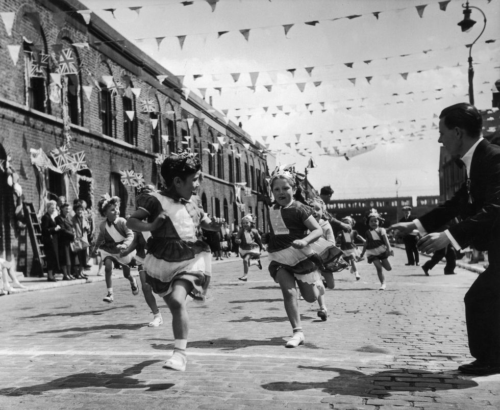 2nd june 1953 the children of morpeth street in london's east end enjoying a street party in celebration of the coronation of queen elizabeth ii original publication picture post 6542 cockneys' own party pub 1953 photo by john chillingworthpicture postgetty images