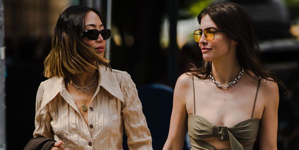 two women at fashion week wear spring outfits to illustrate a guide to spring clothing on amazon 2023