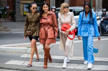 milan, italy   september 19 anna rosa vitiello wearing cycle pants, olive double breasted jacket, fendi bag, bettina looney wearing rusty brown coat, boots, xenia adonts wearing red fendi bag, creme white dress, chrissy rutherford wearing blue jacket and pants seen outside the fendi show during milan fashion week springsummer 2020 on september 19, 2019 in milan, italy photo by christian vieriggetty images